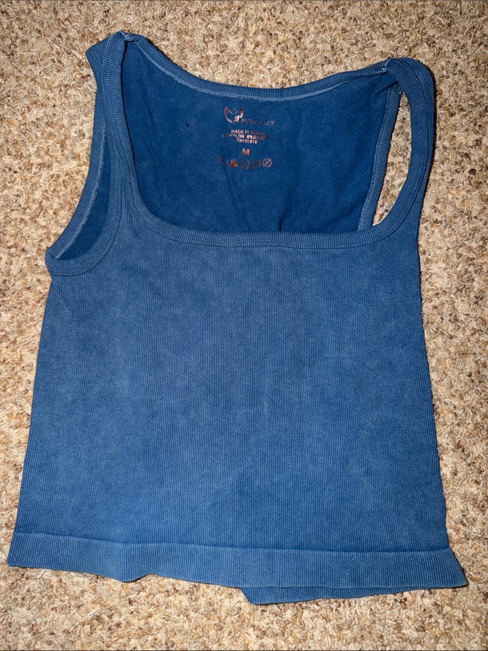 blue ribbed tank top is from Angel Cult